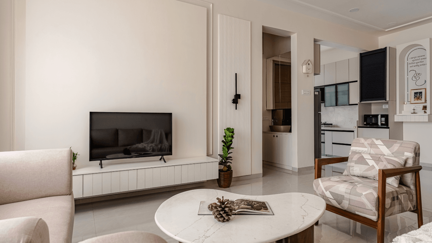 Minimal living room with a floating TV console and warm neutral tones