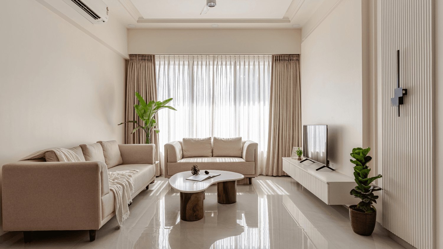 Minimalist living room styled with layered neutral textures and soft daylight