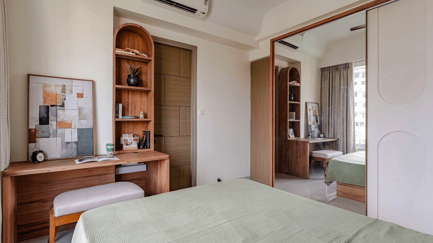 Parents' bedroom with a mirrored wardrobe and built-in study nook